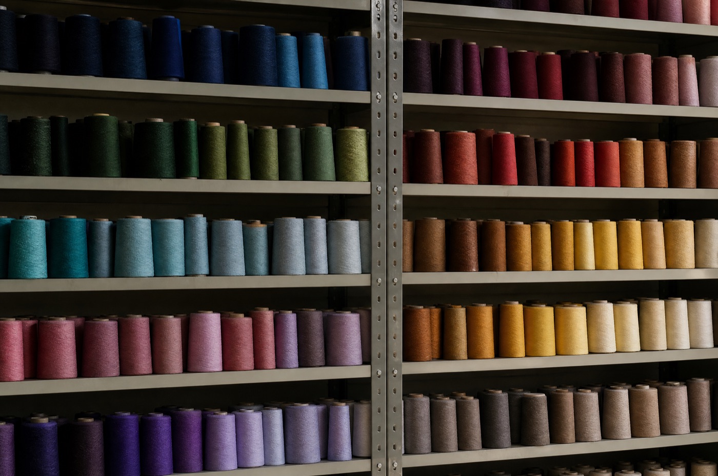 Thread cones in ordered ranks, standing in for the boudoir pillow.